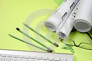 Workplace of architect - rolls and plans. Construction background.