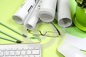 Workplace of architect - rolls and plans. Construction background.