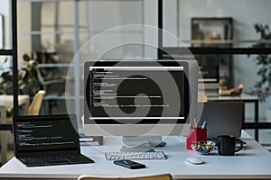 Workplace with computers with codes