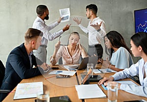 Workplace Conflicts. Stressed Group Of Business People Having Disagreements During Corporate Meeting