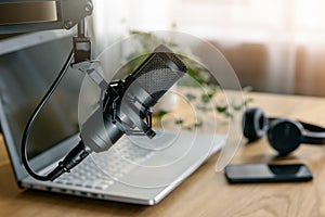 Workplace of content creator. home studio for podcasting, online streaming, radio broadcasting. microphone closeup