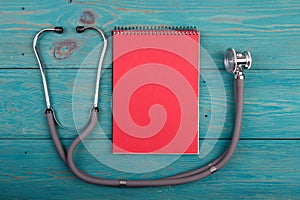 Workplace of doctor - stethoscope, notepad