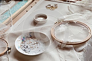 Workplace of an embroiderer with embroidery frames,