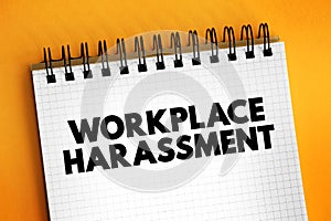 Workplace Harassment is the belittling or threatening behavior directed at an worker, text concept on notepad