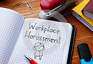 Workplace Harassment is shown on the conceptual business photo