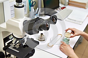 Workplace with microscope in laboratory biochemical