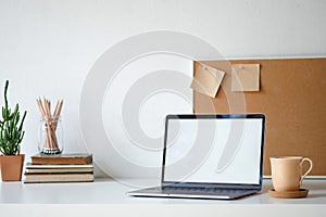 Workplace mockup concept. Selective focus Mockup home decor laptop computer and office object with copy space for products