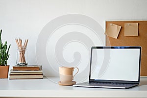 Workplace mockup concept. Selective focus Mockup home decor laptop computer and office object with copy space for products