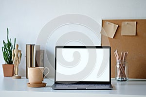 Workplace mockup concept. Selective focus Mockup home decor laptop computer and office object with copy space for products