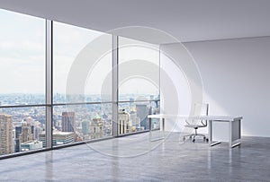 A workplace in a modern corner panoramic office in New York, Manhattan. A white leather chair and a white table.