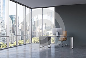 A workplace in a modern corner panoramic office with New York view.