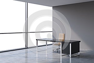 A workplace in a modern panoramic office, copy space view from the windows. A concept of financial consulting services.