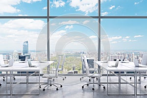 Workplaces in a modern panoramic office, New York city view from the windows. A concept of financial consulting services.