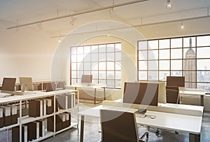 Workplaces in a sunset loft open space office.