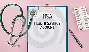 Worksheet with the inscription Health Savings Account HSA  stethoscope and pills