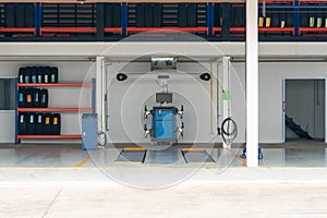 Workshop bay of wheel alignment in a car repair station.