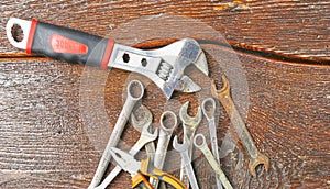 Workshop bench. Variety of hand tools on a wooden table, top view, copy space