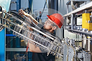 Workshop with extruders for the production of plastic bottles