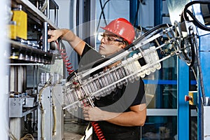 Workshop with extruders for the production of plastic bottles