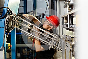 Workshop with extruders for the production of plastic bottles