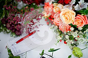 Workshop florist, table with flowers, still life. Soft focus