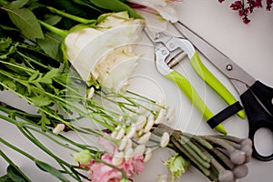 Workshop florist, table with flowers, still life. Soft focus