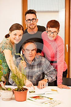 Workshop of knowing herbs, touching and smelling basil and thym. Intergenerational transfer of knowledge.