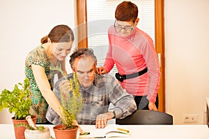 Workshop of knowing herbs, touching and smelling basil and thym. Intergenerational transfer of knowledge.