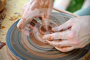 Workshop of ukrainian traditional handmade ceramic pots on the wheel