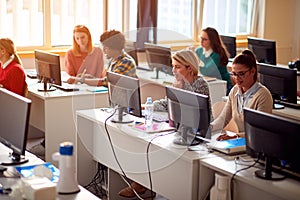 IT workshop at university. Group of Students on class with computer