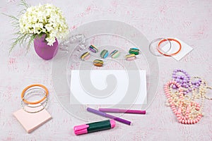 Workspace with computer, bouquet Hydrangeas, clipboard. Women`s fashion accessories isolated on pink background. Flat