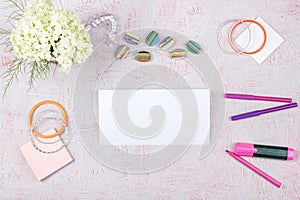 Workspace with computer, bouquet Hydrangeas, clipboard. Women`s fashion accessories on pink background. Flat