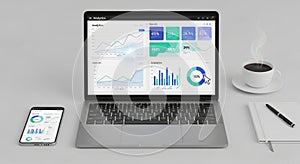 A workspace features a laptop and