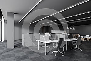 Workspace in grey open space office corner