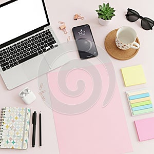 Workspace includes a laptop with a blank screen smartphone displaying