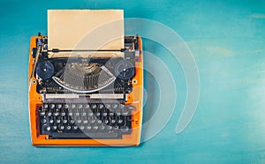 Workspace with vintage orange typewriter