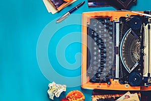 Workspace with vintage orange typewriter