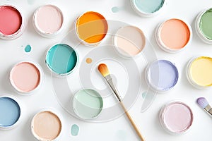 worktable with arranged acrylic paint samples in soft tones