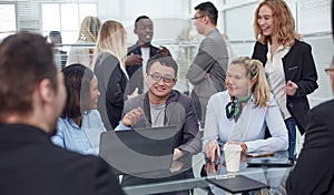 Workteam in office working on desktop computer