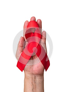 World aids day and national HIV AIDS and ageing awareness month with red ribbon on helping hand