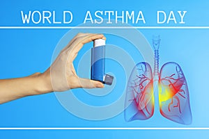 World asthma day. Woman holding inhaler on blue background, closeup