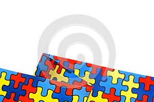 World Autism awareness and pride day with Puzzle pattern ribbon isolated on white