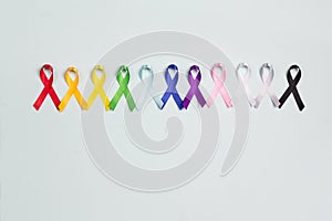 World cancer day concept, February 4. Colorful awareness ribbons on blue background