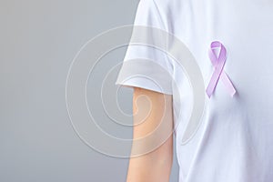 World cancer day February 4. Lavender purple ribbon for supporting people living and illness. Healthcare and medical concept