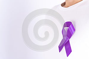 World cancer day, purple ribbon on chest isolated grey background. Healthcare and medical concept