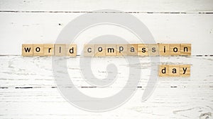 World Compassion Day.words from wooden cubes with letters photo