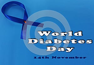 World diabetes day, 14  november. The blue ribbon with red blood drop isolated on blue background. Diabetes symbols