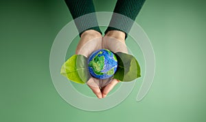 World Earth Day Concept. Green Energy, ESG, Renewable and Sustainable Resources. Environmental and Ecology Care. Hands of Person