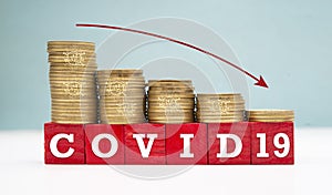 World Economies sinking down due to coronavirus pandemic shows with coins