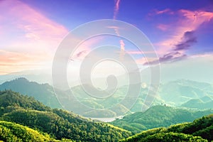 World Environment Day concept: Amazing mountain landscape with colorful sunset on the cloudy sky